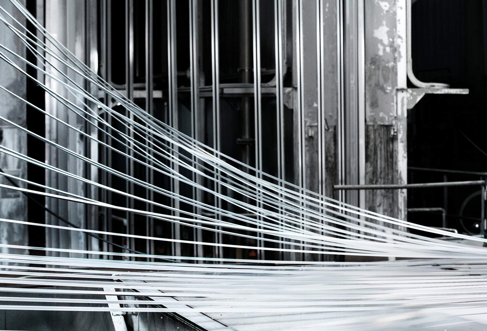 Lengths of aluminum emerging from a paint line