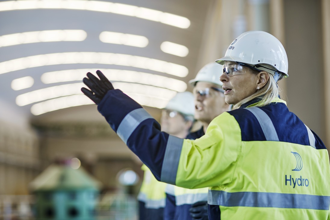 a few people wearing hard hats