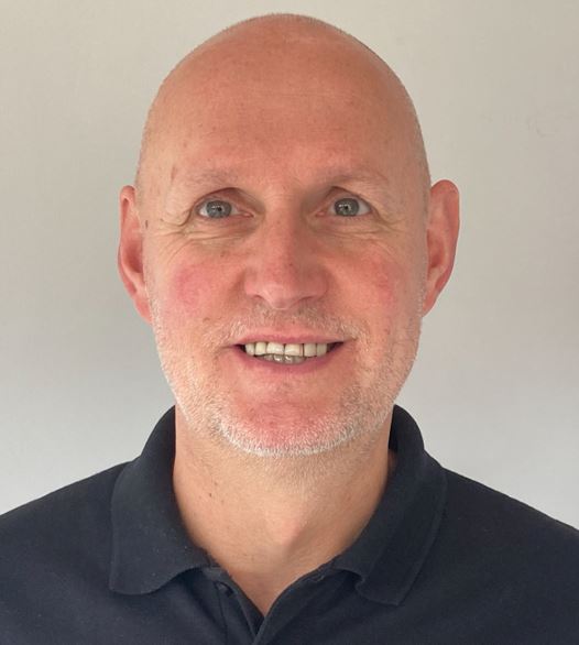 a bald man with a black shirt